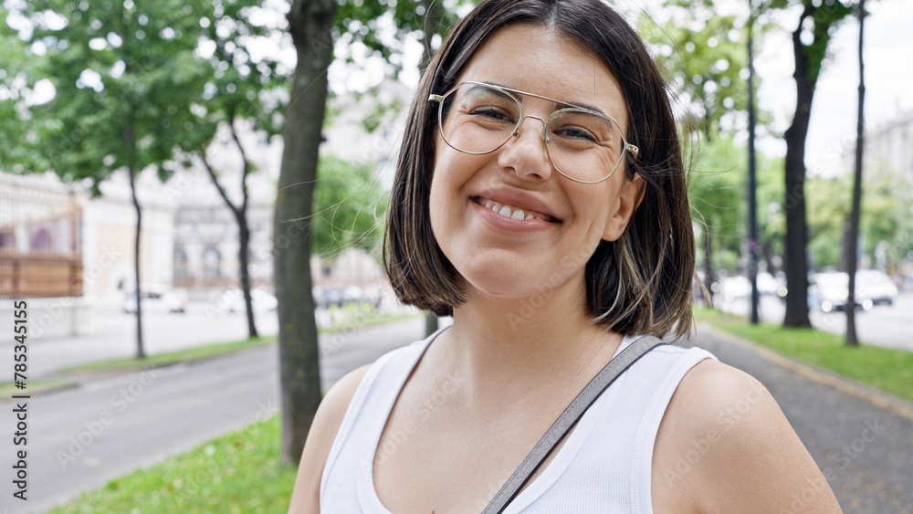 Young beautiful hispanic woman taking selfie at the park in Vienna Young beautiful hispanic woman taking selfie at the park in Vienna