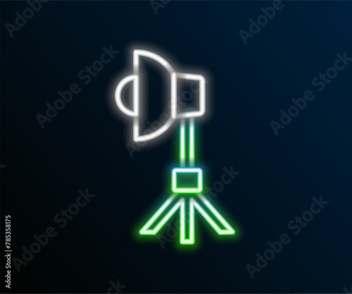 Glowing neon line Studio light bulb in softbox icon isolated on black background. Shadow reflection design. Colorful outline concept. Vector