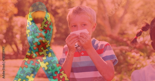 Image of colourful puzzle pieces ribbon over children blowing their noses