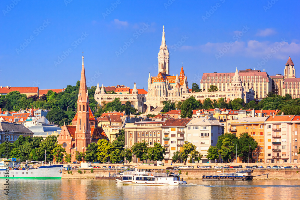 City summer landscape - view of the Buda Castle, palace complex on Castle Hill with Matthias Church over the Danube river in Budapest, Hungary City summer landscape - view of the Buda Castle, palace complex on Castle Hill with Matthias Church over the Danube river in Budapest, Hungary