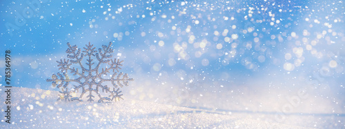 Christmas winter background  banner - view of decorative snowflake in sparkling snow  copy space for text