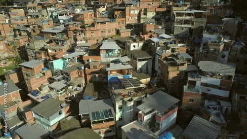 Aerial flying close over hillside favela houses in Rio de Janeiro, Brazil photo