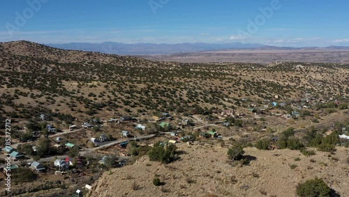 Beautiful drone view of Madrid, New Mexico, USA, historical little town in the hills with colorful houses and clear blue sky of a nice sunny autumn day.