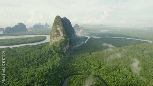 Experience the serene beauty of southern Thailand's mangrove at sunrise in stunning drone footage.