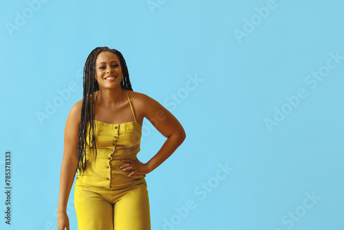 portrait of young adult beautiful african american woman with braid hair posing at studio