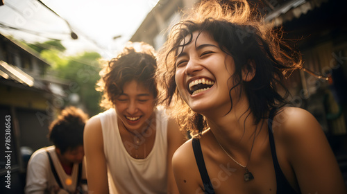 Three young women walking and laughing photo