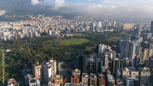 Aerial drone view of Quito capital city of Ecuador South America Parque La Carolina Sunrise early morning traffic