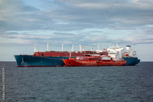 LNG gas oil tankers transferring gas. LNG tankers during ship-to-ship gas transfer operation