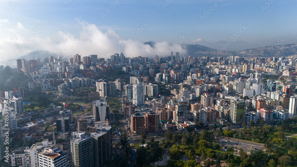 Aerial drone view of Quito capital city of Ecuador South America Parque La Carolina Sunrise early morning traffic
