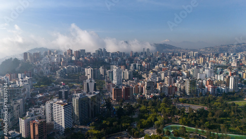 Aerial drone view of Quito capital city of Ecuador South America Parque La Carolina Sunrise early morning traffic