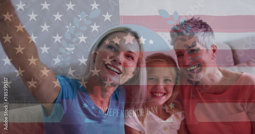 Image of waving usa flag over happy caucasian family photo