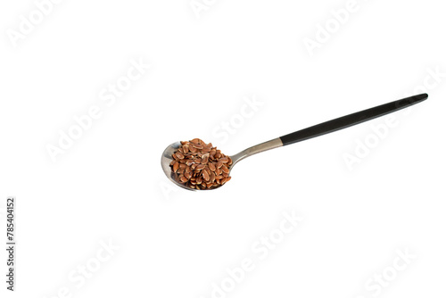 Flax seeds in a spoon. Raw whole linseed isolated on white background.