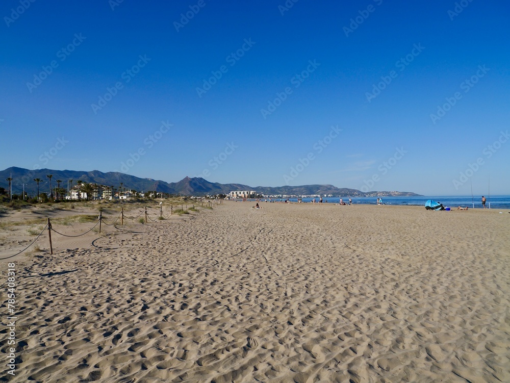 Obraz premium Landscape of the beach with mountains, Mediterranian cost of Spain, El Grao de Castellon, Valencia, Spain