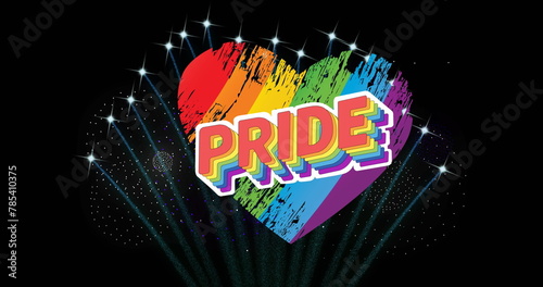 Image of pride text and rainbow heart and fireworks exploding on black background