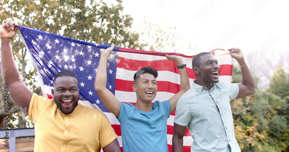 Fototapeta premium Image of go vote text and american flag with happy diverse friends celebrating and waving flags