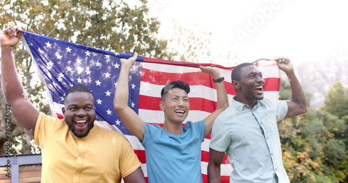 Image of go vote text and american flag with happy diverse friends celebrating and waving flags