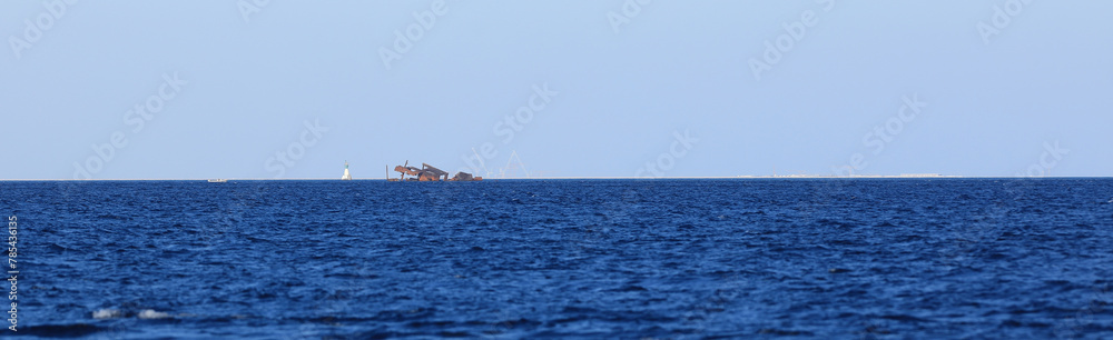 sunken rusty ship on the sea