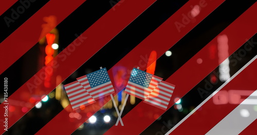 Image of red and white stripes and usa flags appearing over night cityscape