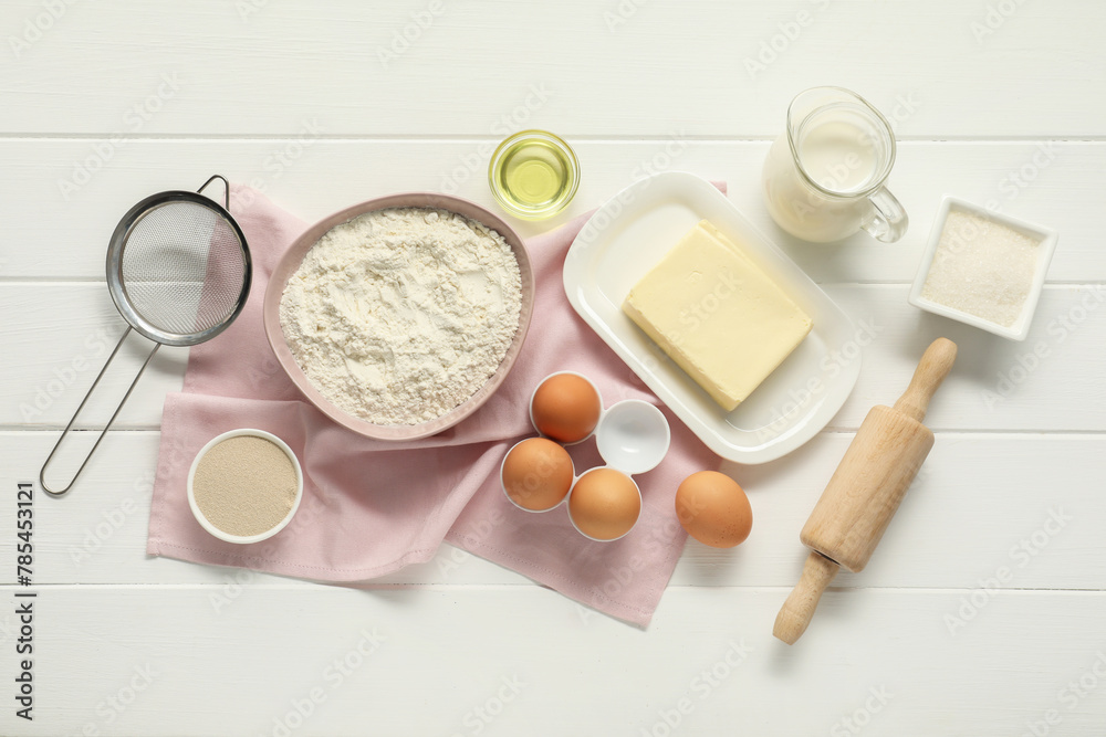 Flat lay composition with fresh butter and other products on white wooden table Flat lay composition with fresh butter and other products on white wooden table
