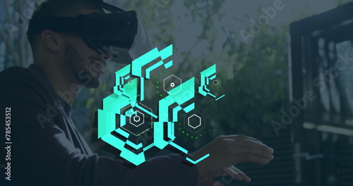 Image of hexagon shapes over caucasian businessman wearing virtual reality simulator in office