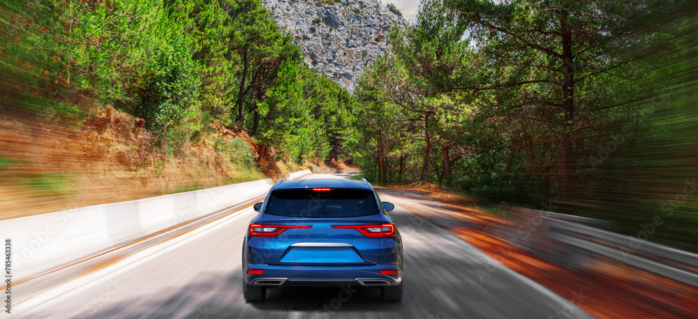 A car rushes along a forest road. Motion effect added.
