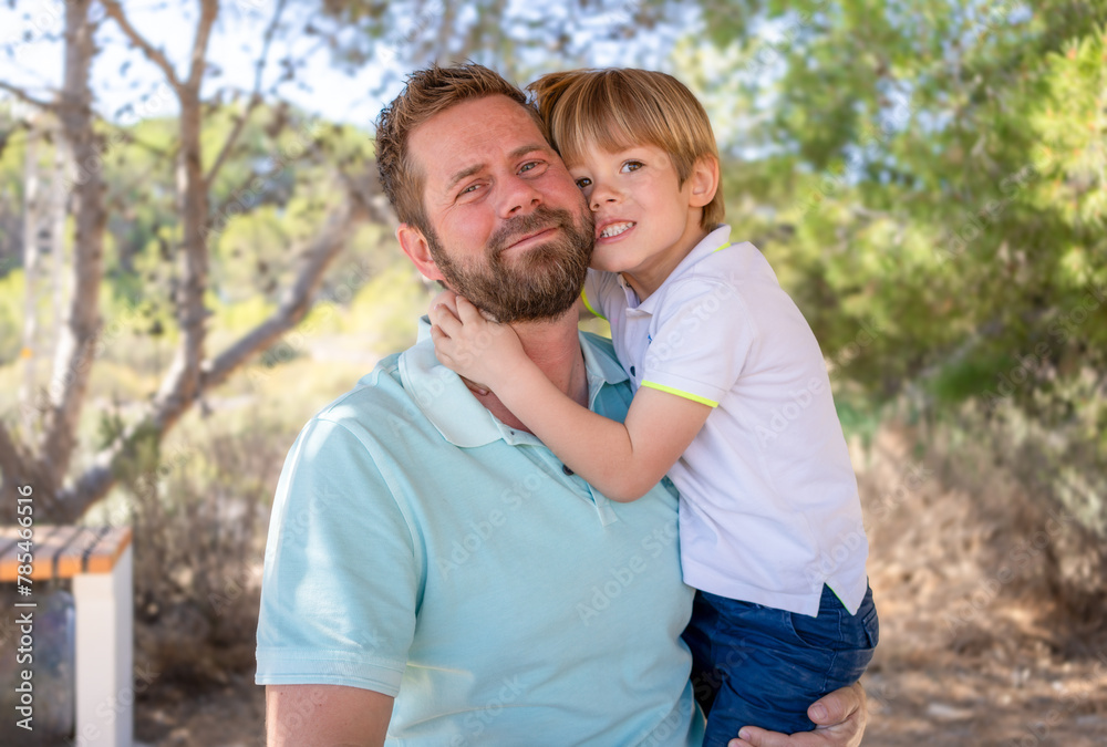 Portrait Of Father And little son In countryside Portrait Of Father And little son In countryside