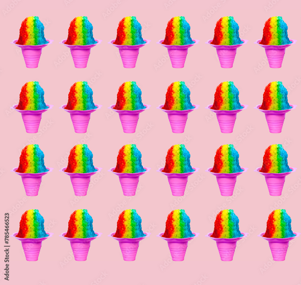 Repetitive Rainbow Hawaiian Shave Ice, Shaved Ice or Snow Cone desserts arranged on a pink as a background