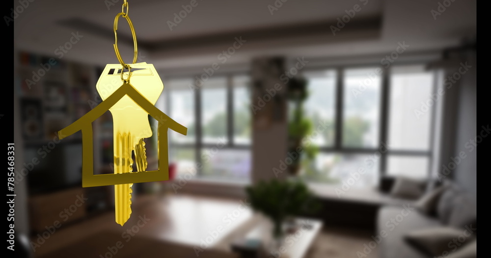 Image of key with house keychain over house interior Image of key with house keychain over house interior