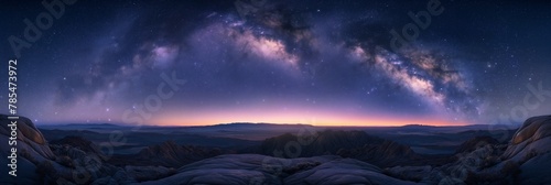 A star-studded sky illuminates the sprawling desert landscape below