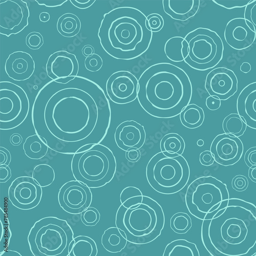 Circles on the water. Summer rain. Seamless pattern on a  blue background. Vector illustration.