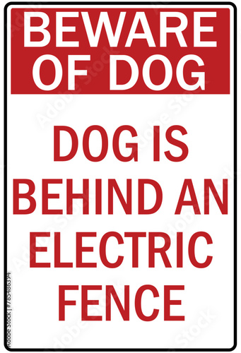 Beware of dog warning sign dog is behind an electric fence