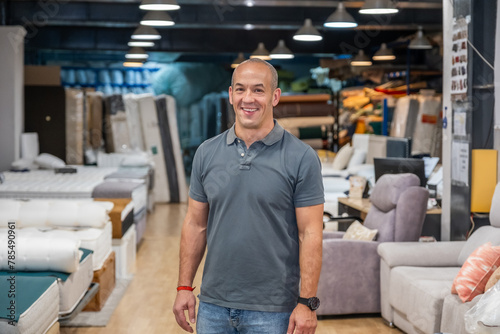 A mattress salesman in his shop