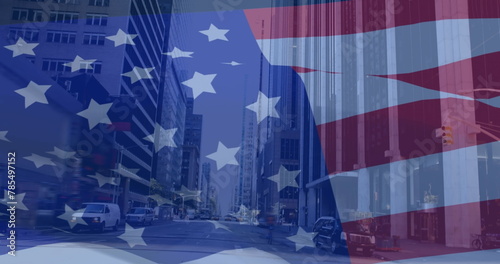 Image of waving usa flag against view of tall buildings in the city
