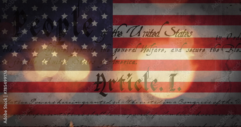 Fototapeta premium Image of out of focus glowing sparkles and american constitution text over american flag