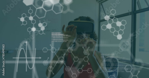 Image of chemical compounds and medical data processing over woman wearing vr headset photo