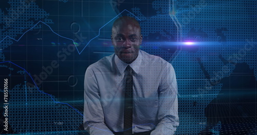 Image of african american businessman talking over data processing