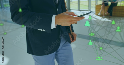 Image of data processing over biracial businessman using smartphone
