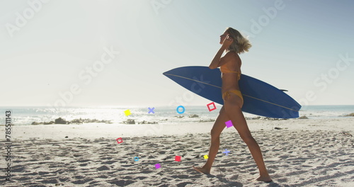 Image of shapes appearing over caucasian woman with surfing board walking on beach