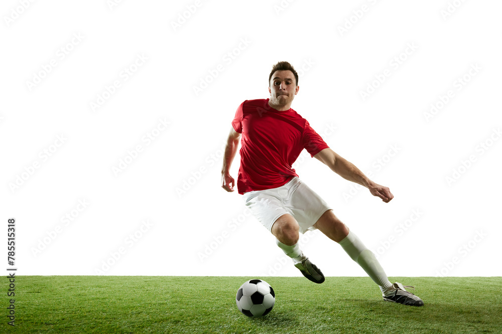 Man, football player in motion during game training, running on filed with ball isolated on white background. Concept of professional sport, game, competition, tournament, action, active lifestyle Man, football player in motion during game training, running on filed with ball isolated on white background. Concept of professional sport, game, competition, tournament, action, active lifestyle