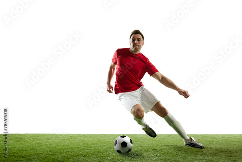 Man, football player in motion during game training, running on filed with ball isolated on white background. Concept of professional sport, game, competition, tournament, action, active lifestyle © master1305