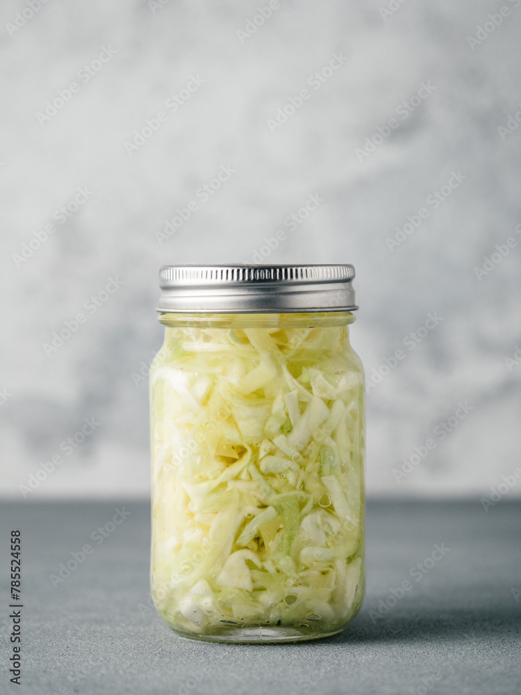 Sauerkraut in open glass jar, copy space Sauerkraut in open glass jar, copy space