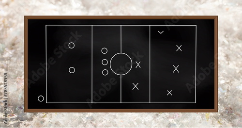 Image of game plan on black board over grey background