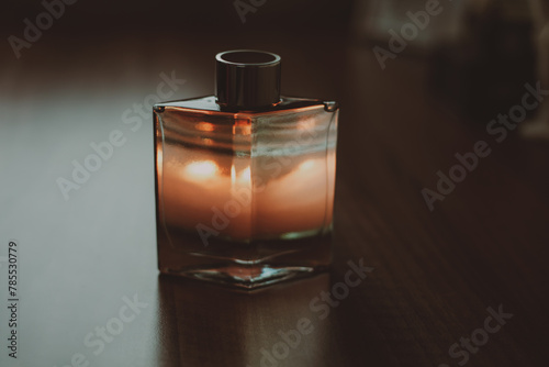 perfume bottle on wooden table