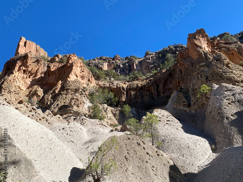 Bandelier National Monument in New Mexico. Hot ash from volcano at Valles Caldera cooled and welded into a rock called tuff. Pajarito Plateau and Frijoles Canyon show Volcanic Geology. 