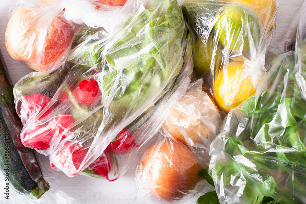 Fototapeta premium single use plastic waste issue. fruits and vegetables in plastic bags