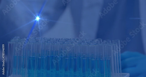 Image of data processing over scientist with pipette in lab