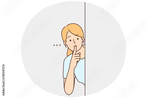 Young woman show hush hand gesture