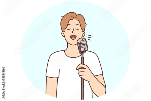 Smiling man sing in microphone