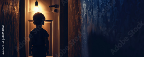 Child's silhouette framed by a doorway their figure illuminated by the harsh glow of a flickering light bulb.