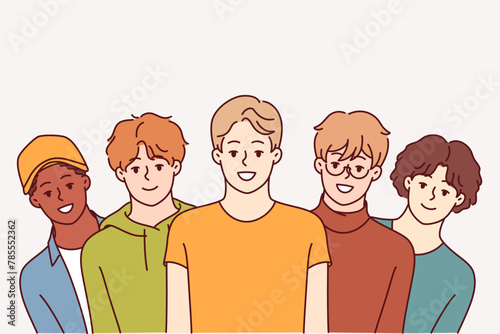 Group of high school guys smile and look at screen, for concept of multi-ethnic society. Positive teenage boys in casual clothes offer to join youth community or become member of university fraternity
